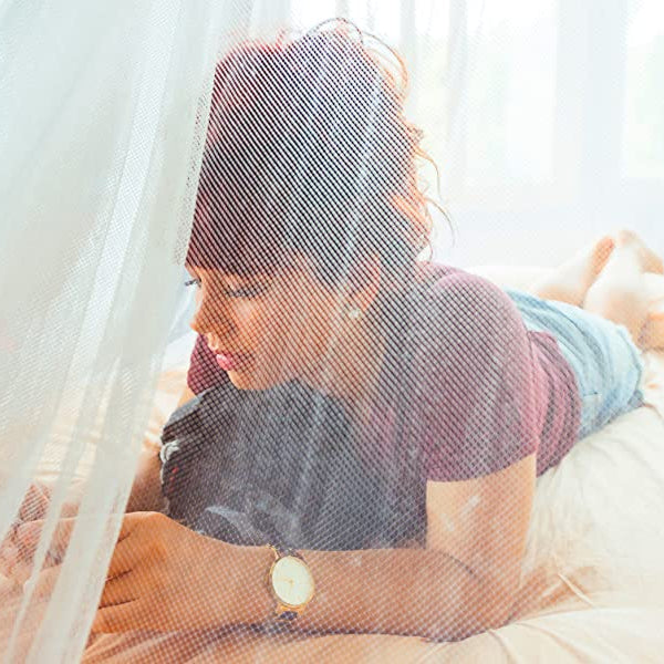Illustration of a person resting comfortably under a mosquito net, creating a peaceful sleep environment.