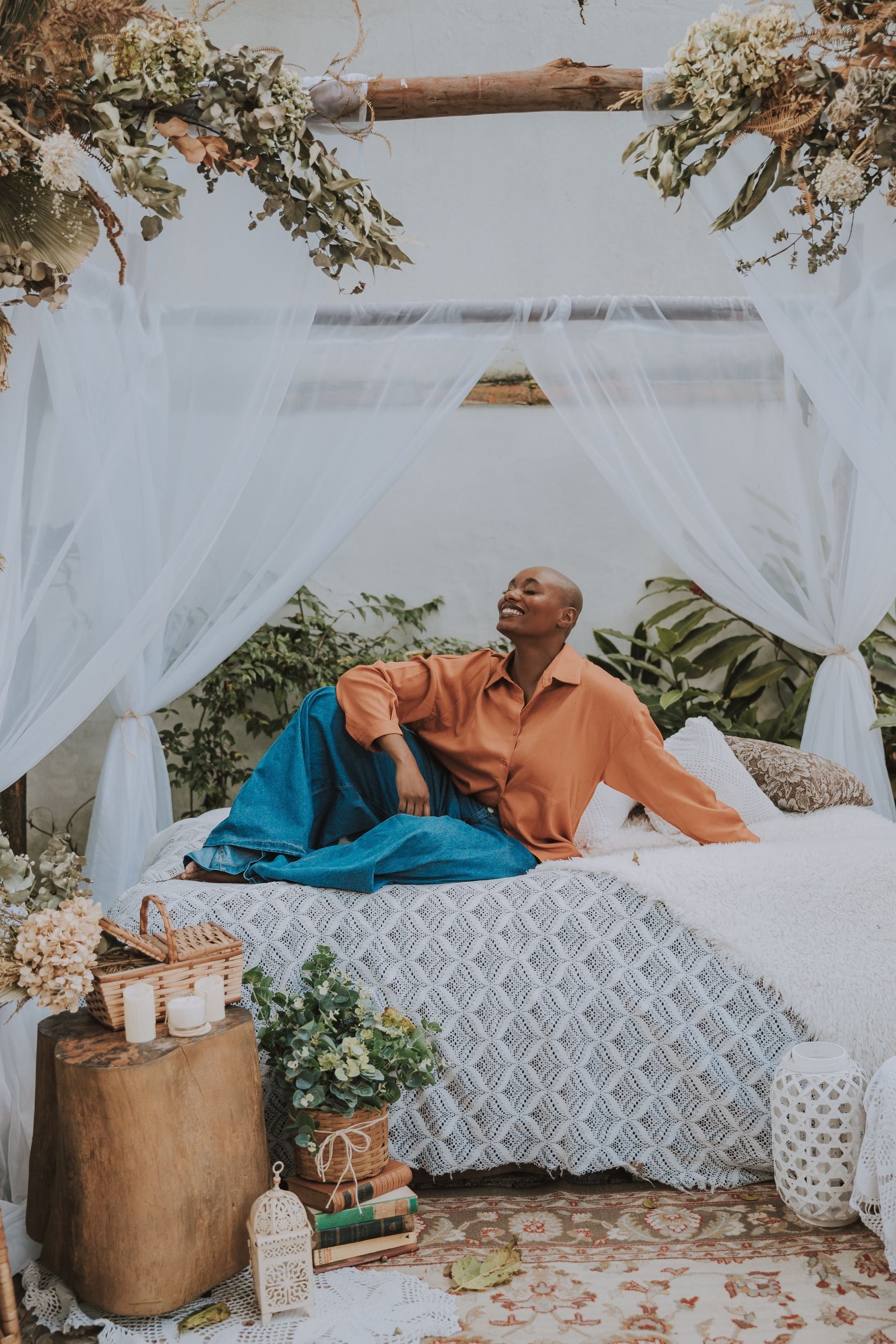 Woman enjoying outdoor space adorned with a decorative mosquito net, creating a stylish and bug-free environment