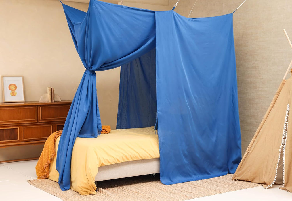 Blue bed canopy covering single bed for elegant minimalist look