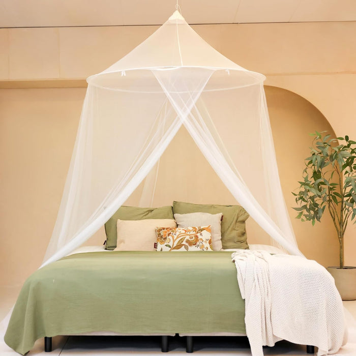 Conical mosquito net canopy hanging over bed creating a safe and comfortable sleeping space