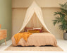 Cream beige mosquito net canopy providing elegant insect protection
