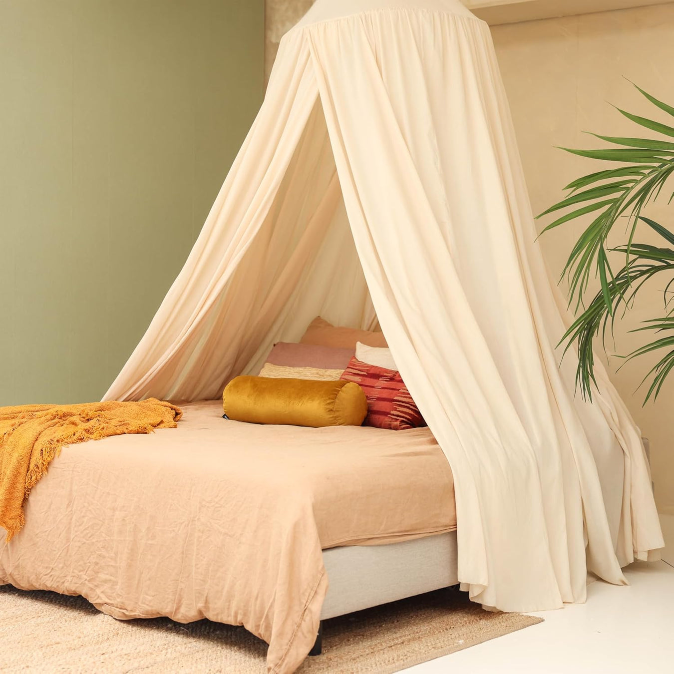 Cream beige bed canopy hanging over Queen size bed in elegant bedroom