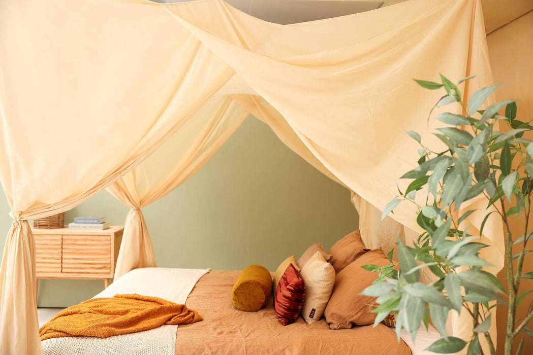 Conical cream beige canopy draped over bed for relaxing bedroom style
