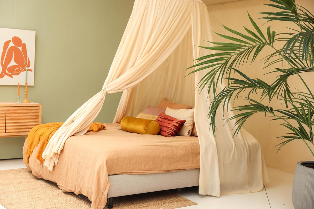 Conical cream beige canopy draped over bed for relaxing bedroom style