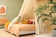 Conical cream beige canopy draped over bed for relaxing bedroom style