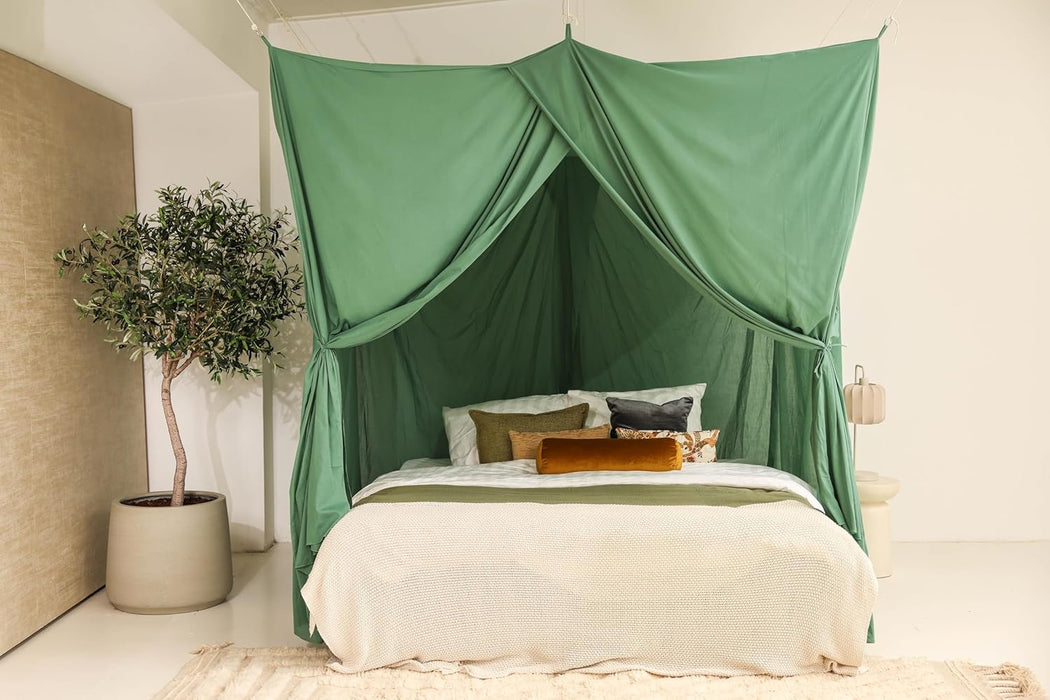 Green rectangular bed canopy hanging over Queen size bed in elegant bedroom