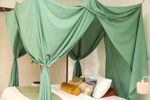 Green bed canopy providing full coverage for large beds
