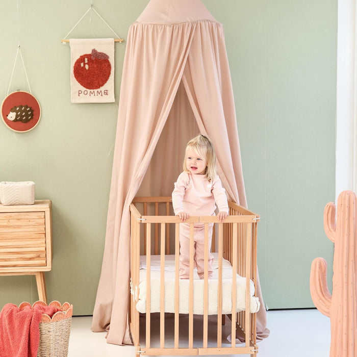 Stylish nougat bed canopy adding cozy touch to children’s bedroom