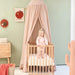 Stylish nougat bed canopy adding cozy touch to children’s bedroom