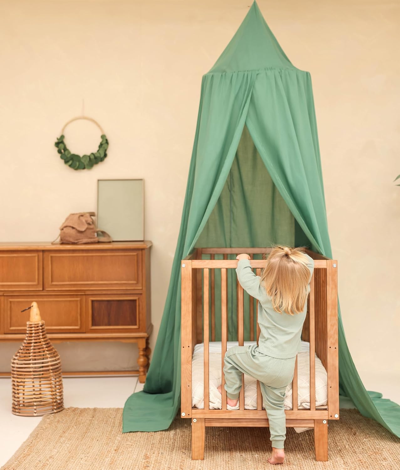 Green nursery canopy tent used as playroom or reading space