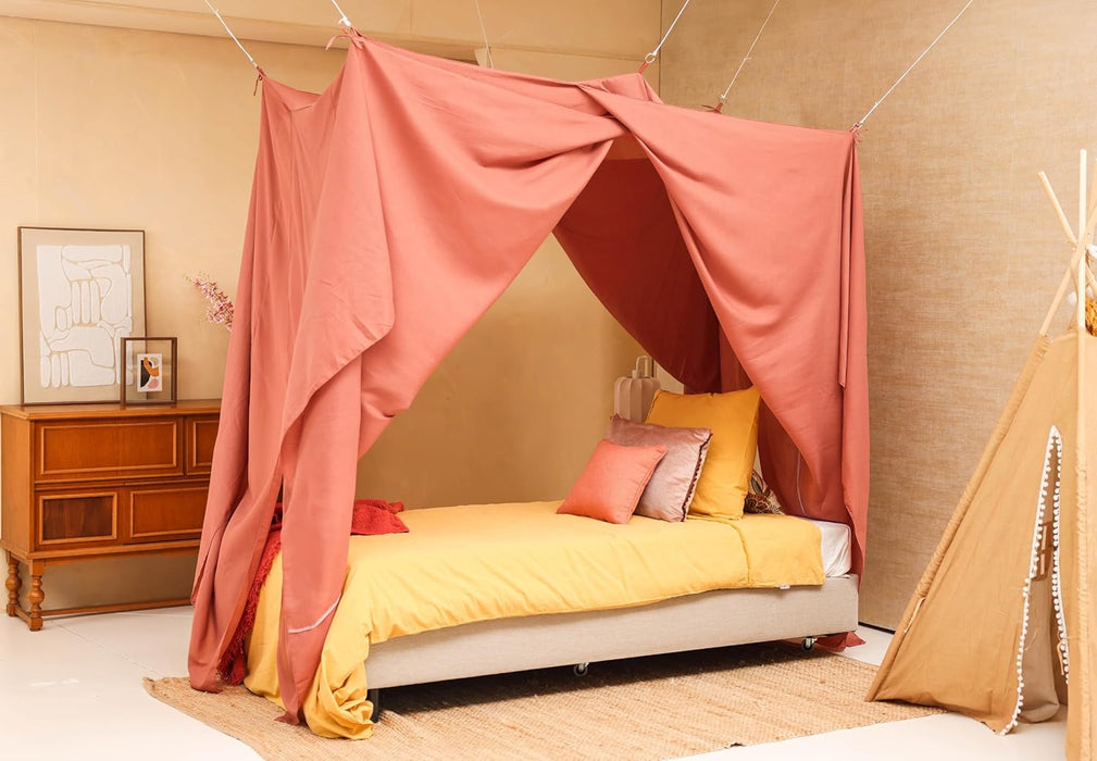 Pink bed canopy covering single bed for dreamy and soft look