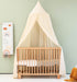 Cream nursery canopy for reading nook or playroom setup