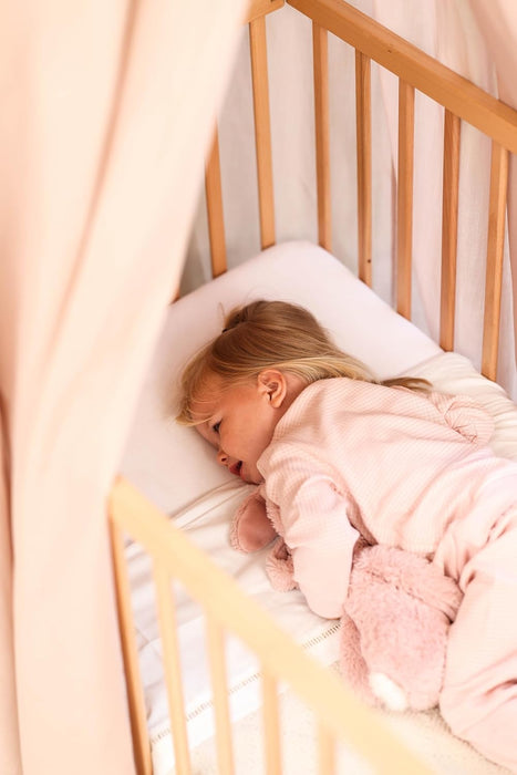 Warm-toned nougat kids canopy for modern nursery décor