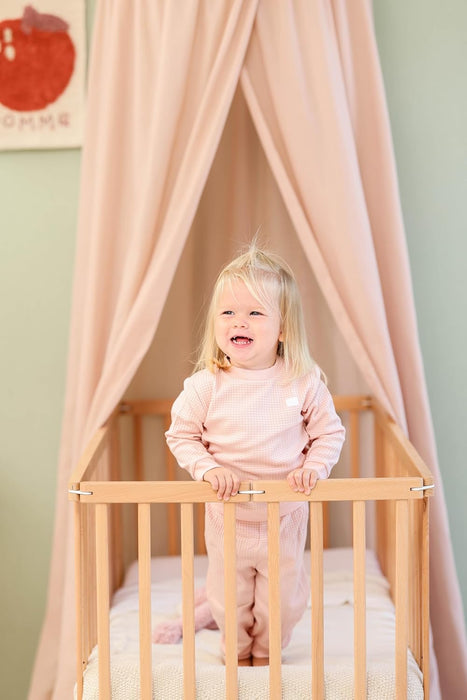 Soft cotton-poly nougat canopy creating cozy play space