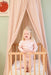 Soft cotton-poly nougat canopy creating cozy play space