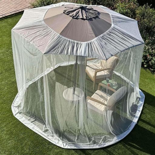 White umbrella mosquito net covering a patio umbrella, providing spacious insect-free outdoor seating area.